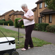 woman receiving starship robot delivery